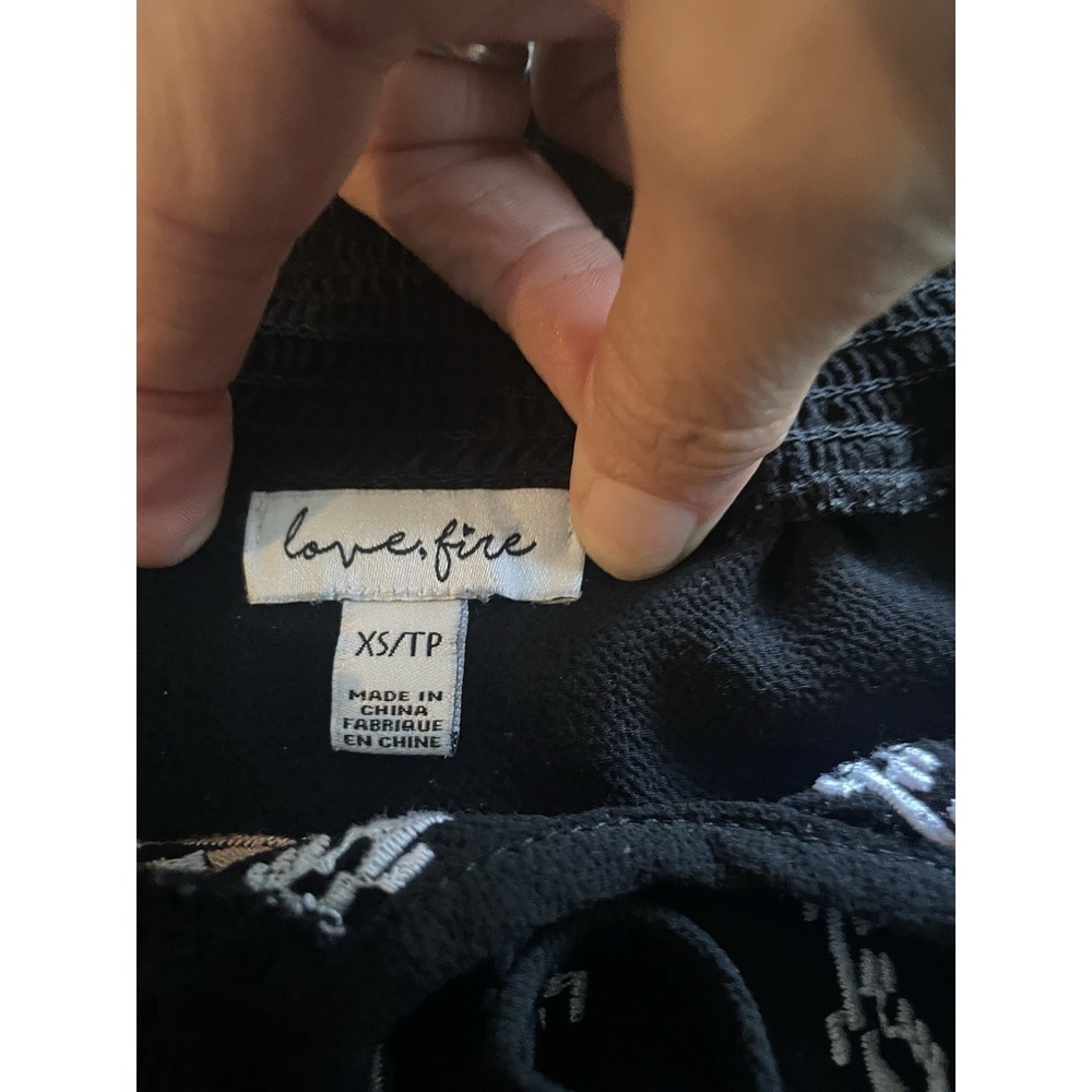 Love Fire XS Black Off Shoulder Embroidered Boho Mini Dress Floral Ruffle Hem - Picture 8 of 8
